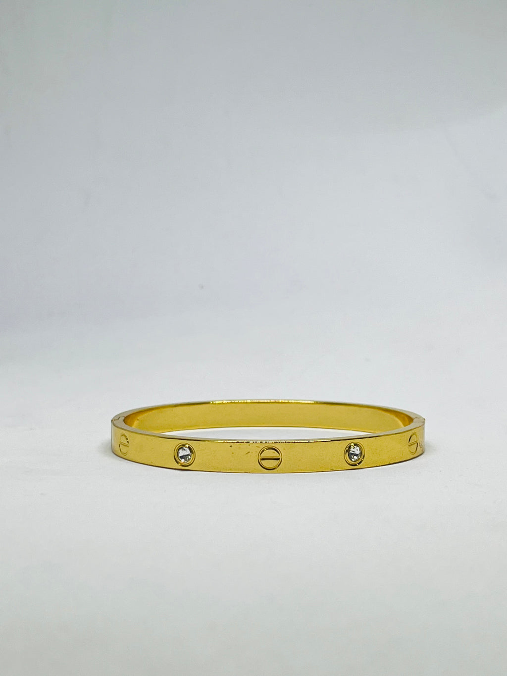 Radiant Gold-Tone Screw Motif Bracelet with Sparkling Stones