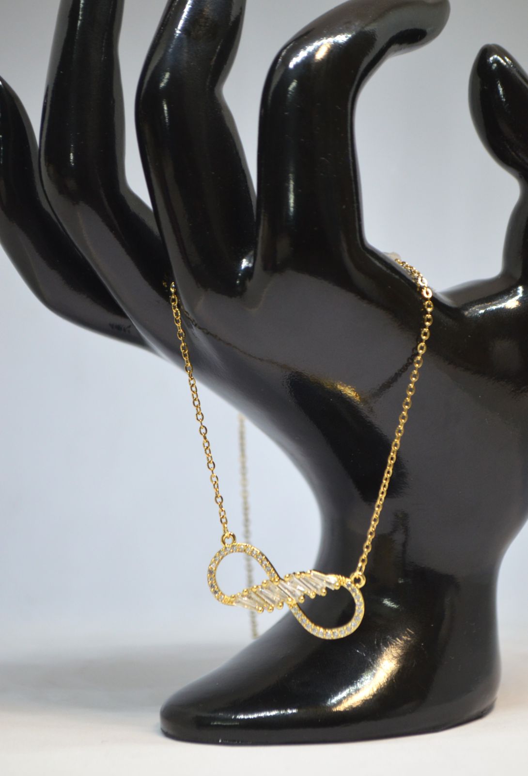 Sparkling Gold Infinity Pendant Necklace with Crystal Detailing